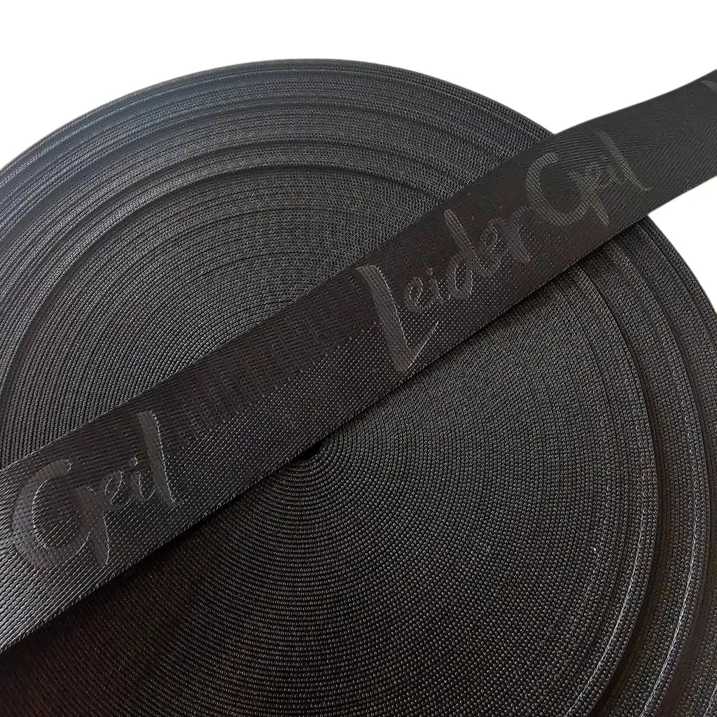 Gurtband Eigenproduktion embossed ’LeiderGeil’ | 25mm